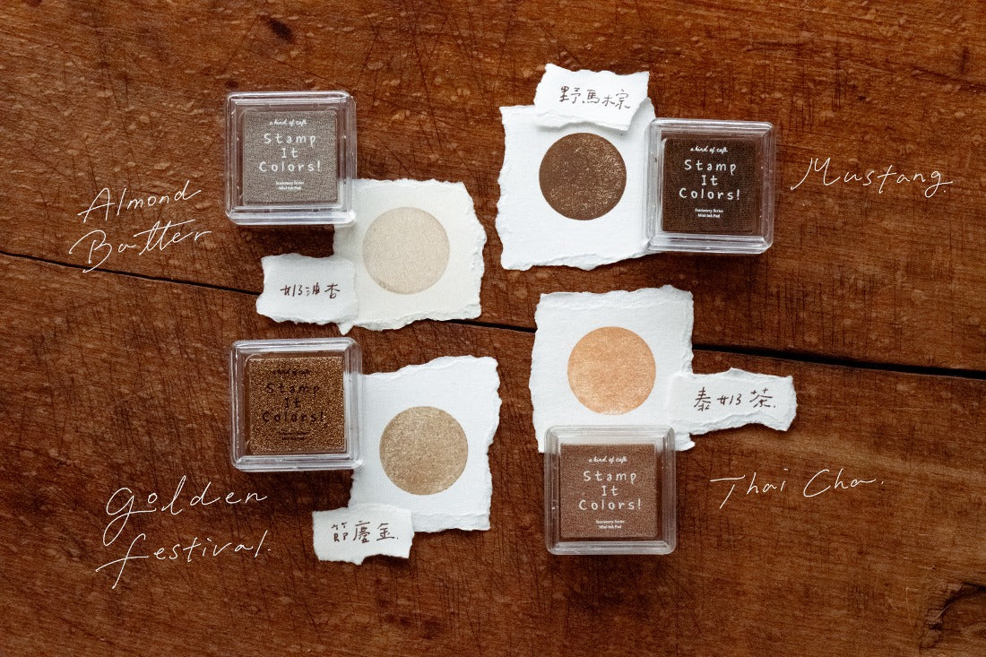 Set of small containers with stamps on a wooden surface
